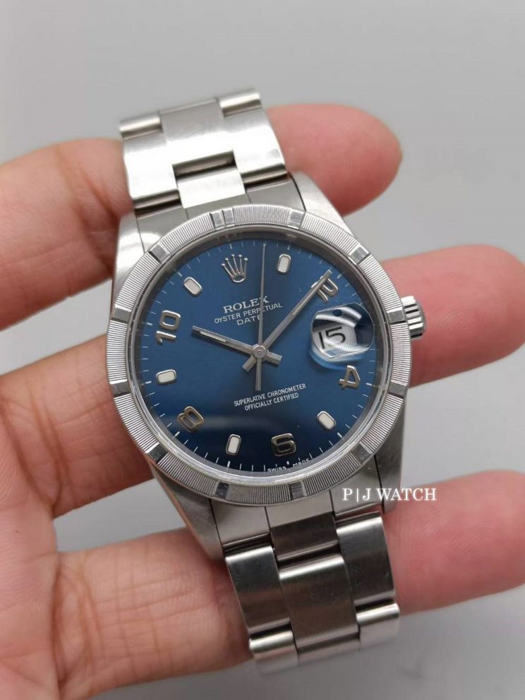 Rolex Oyster Perpetual Date 34mm Steel Blue Dial Engine Turned Bezel Ref.15210