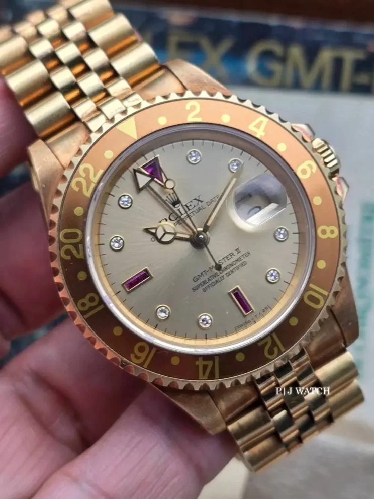 Rolex GMT-Master II 40mm Serti Sultan Diamond Ruby Dial Ref.16718